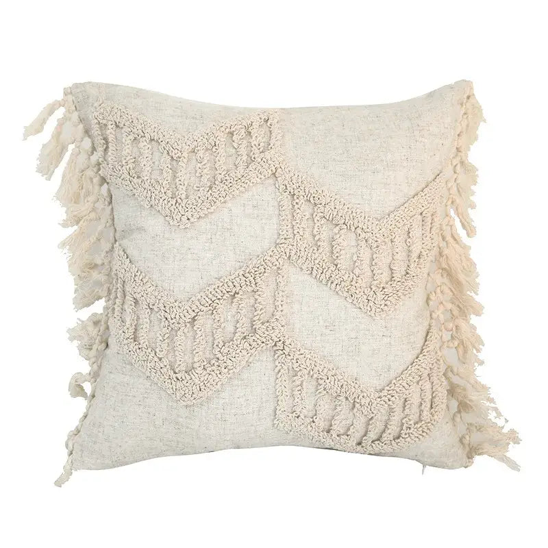 Cream-colored boho style tufted cotton cushion cover with woven zigzag patterns and fringed edges for living room sofa decorbites