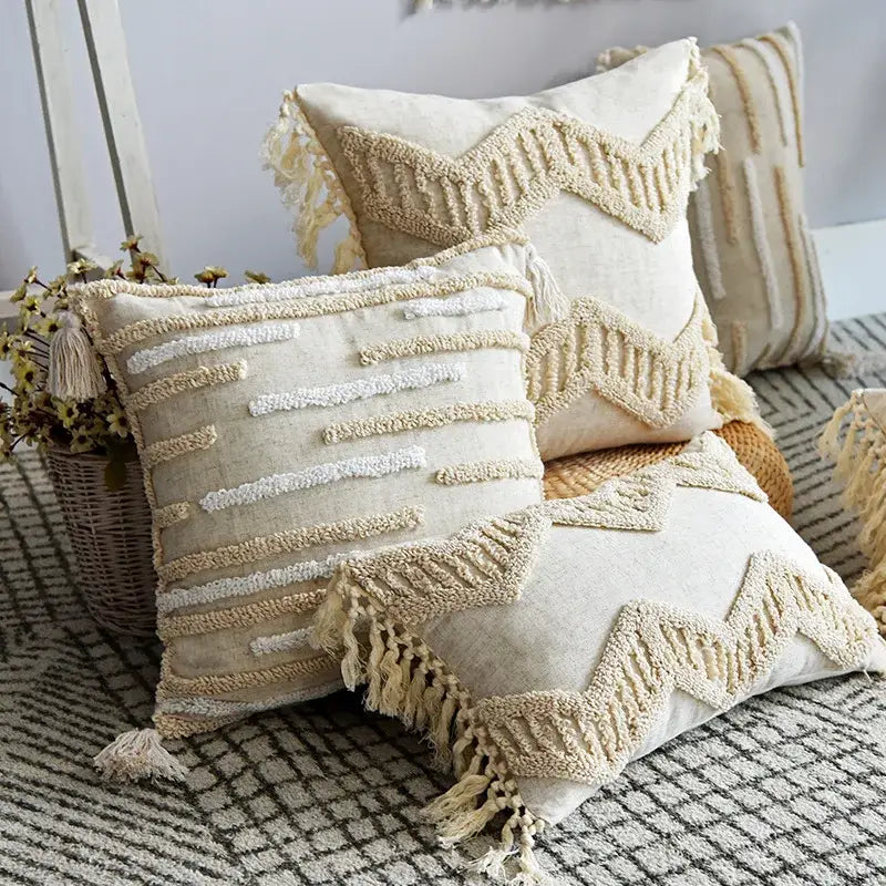 Cream-colored boho style tufted cotton cushion cover with woven geometric patterns and tassels for living room sofa decorbites