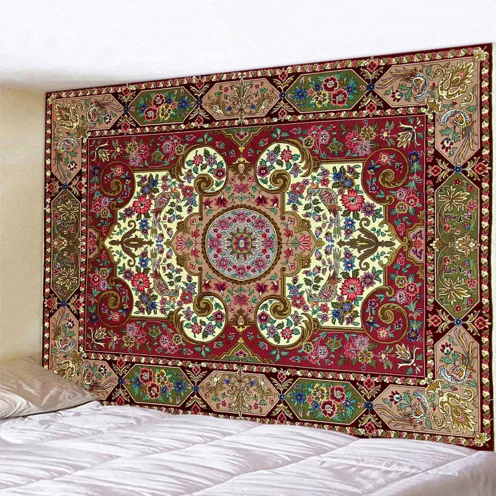 A richly detailed red and gold decorbites boho tapestry set with floral motifs hanging above a bed for bedroom decor