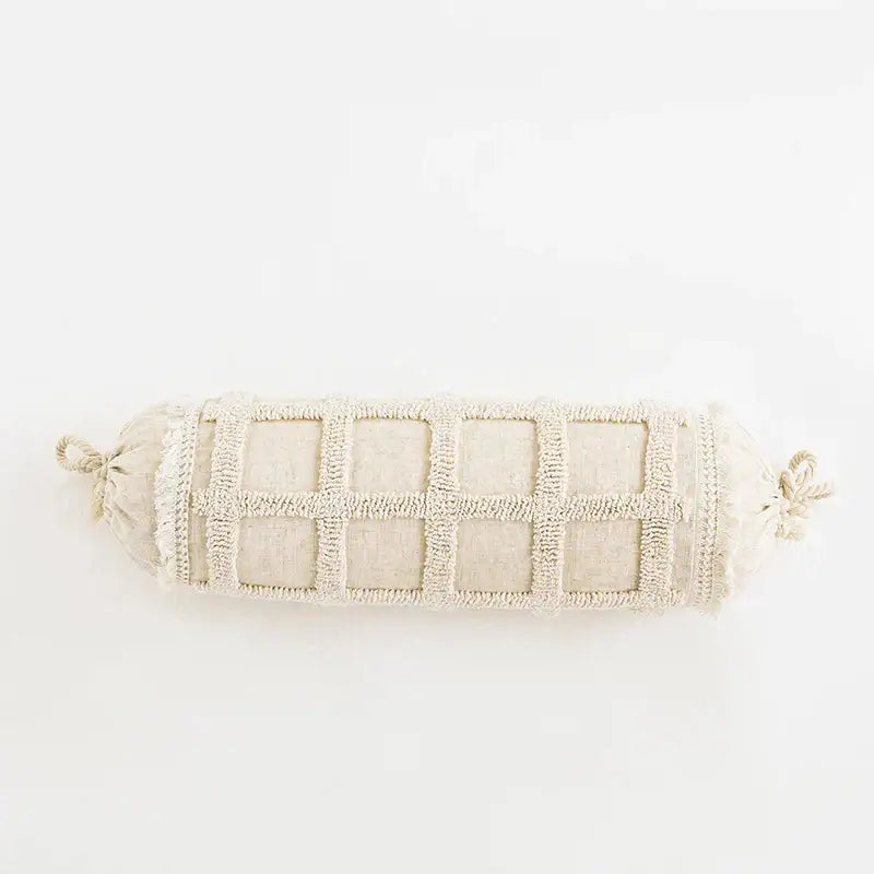 Beige cylindrical cushion cover with textured grid pattern and tied ends for decorbites boho tassel living room decor