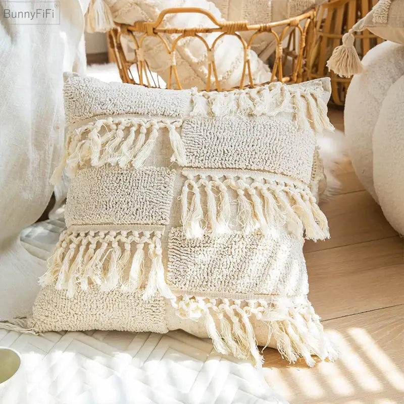 Cream-colored textured patchwork cushion cover with fringed tassels and woven design for boho tassel decorbites style