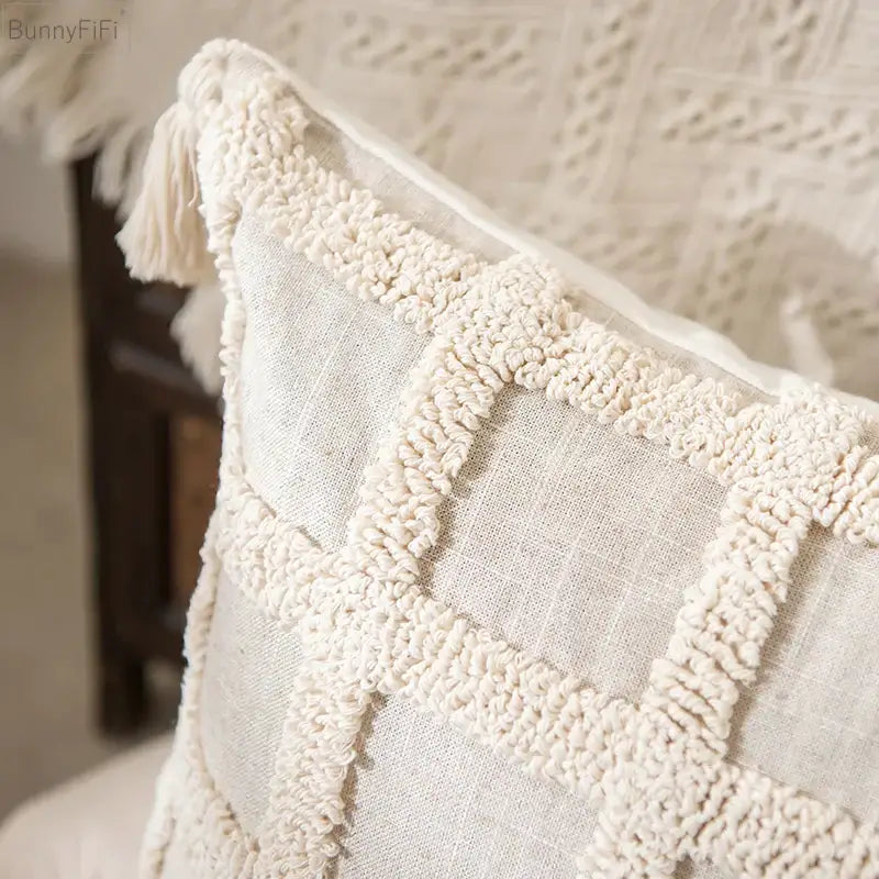Cream-colored boho tassel cushion cover with textured woven grid pattern and tassels for living room decorbites boho tassel decor