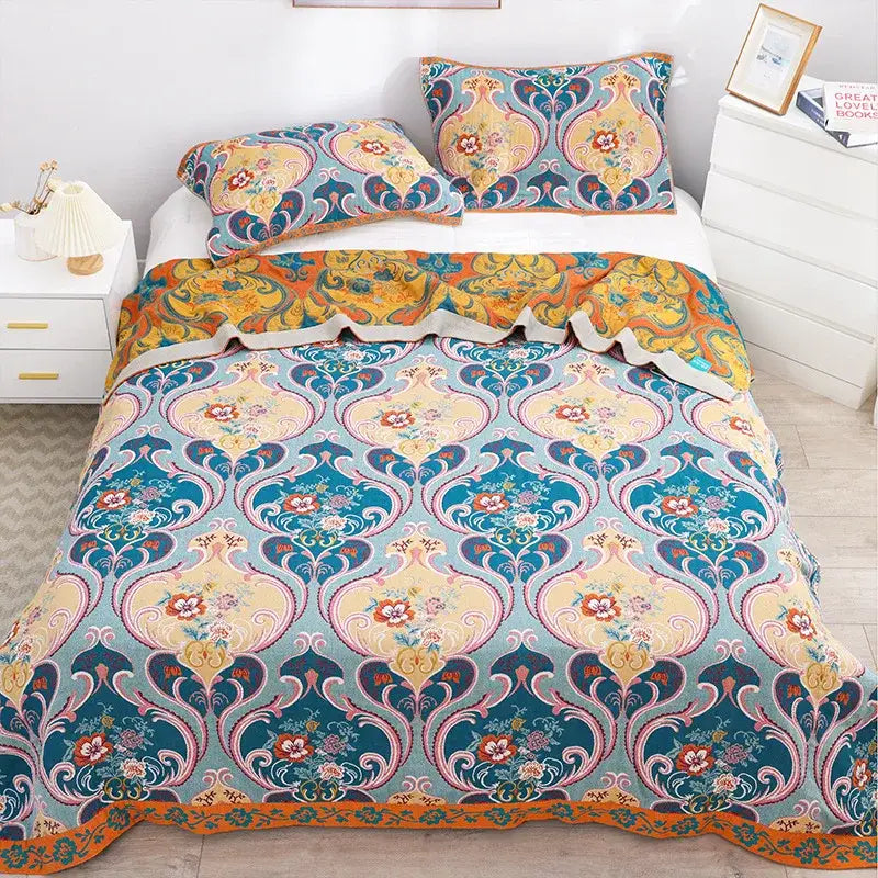 Boho teal floral cotton cover throw blanket with vibrant floral and damask patterns in teal gold orange and cream tones