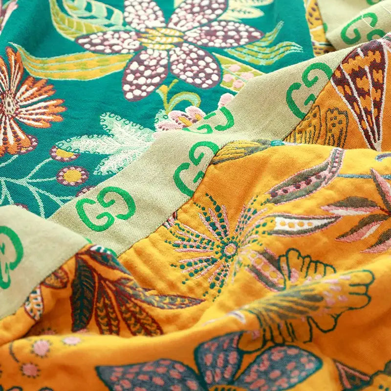 Boho teal floral cotton cover throw blanket featuring vibrant gucci fabric with bold green orange and purple motifs