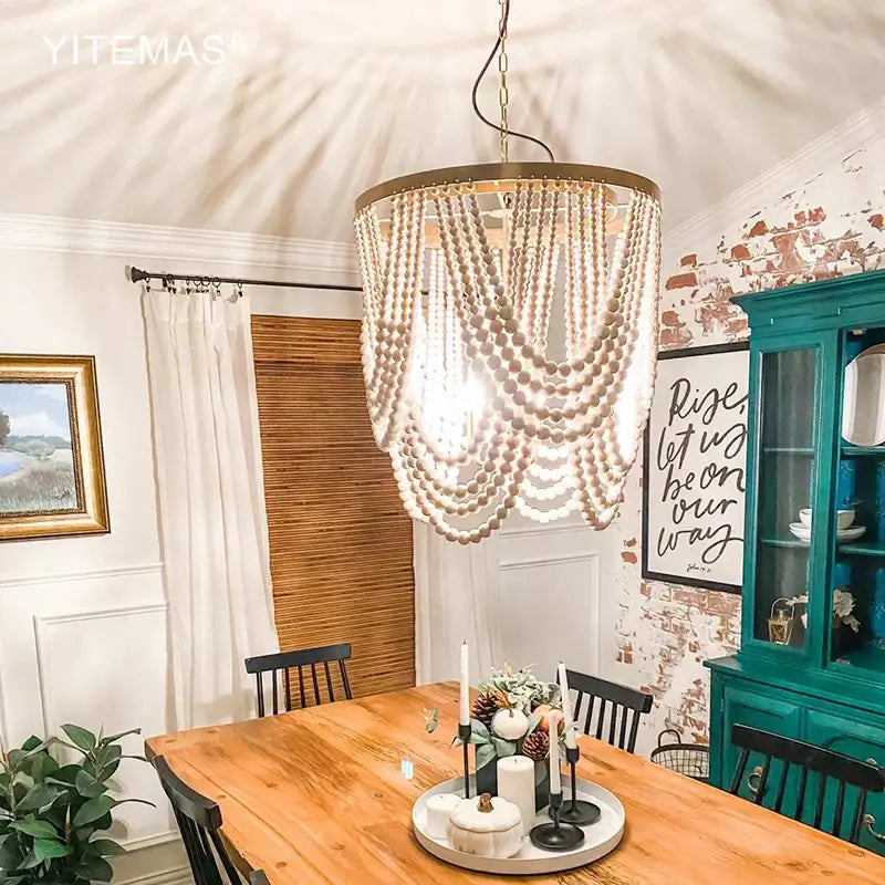 Boho tiered wooden beaded chandelier in light wood with gold-toned frame for dining room lighting