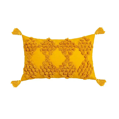 Vibrant mustard-yellow pillow cover with fluffy pom-poms and tassels from decorbites boho tufted beige collection