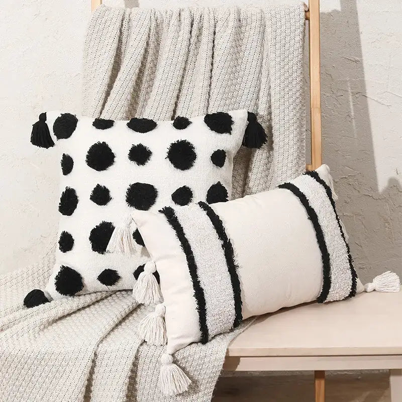 White pillow cover with black polka dots and tassels in decorbites boho tufted beige living room decor