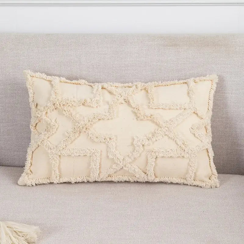 Cream-colored boho tufted beige pillow cover with textured geometric pattern and tassel trim for living room decorbites decor