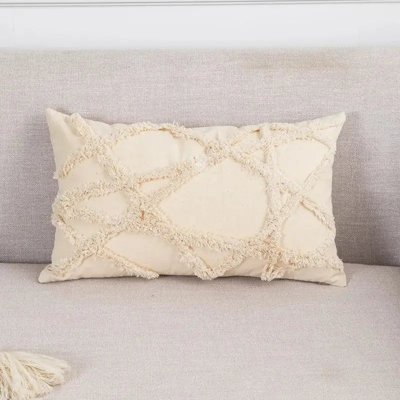Cream-colored boho tufted beige pillow cover with textured frayed geometric pattern for living room decorbites tassel decor