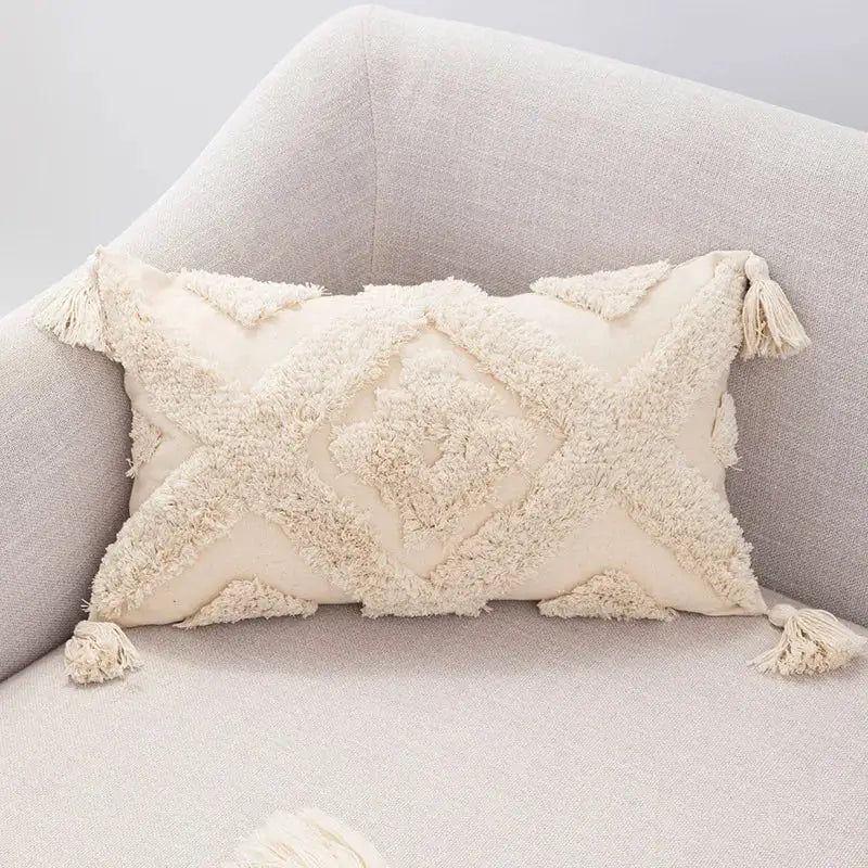 Cream-colored rectangular boho tufted beige pillow cover with woven diamond pattern and tassels for living room decorbites decor