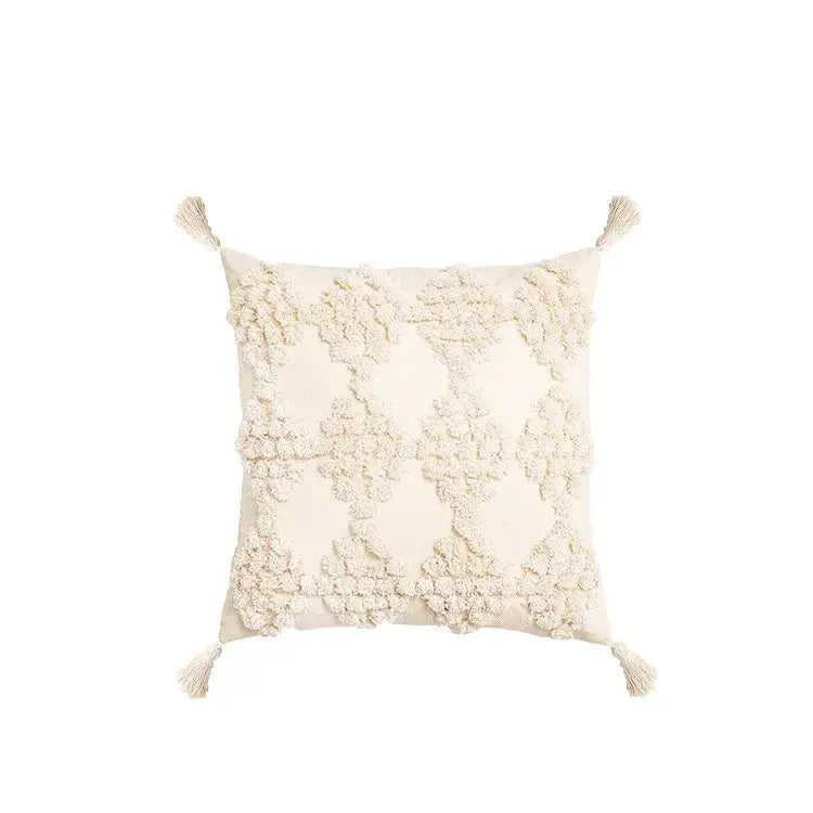 Cream-colored square pillow cover with textured raised floral embroidery and tassels decorbites boho tufted beige design