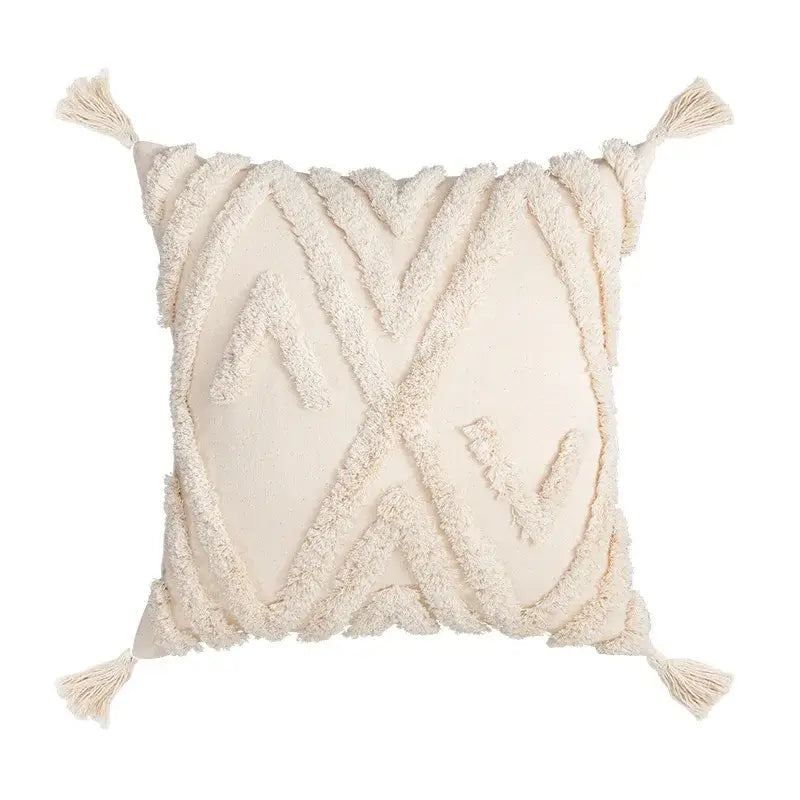 Cream-colored boho tufted beige pillow cover with textured fringed geometric patterns and tassels for living room decor