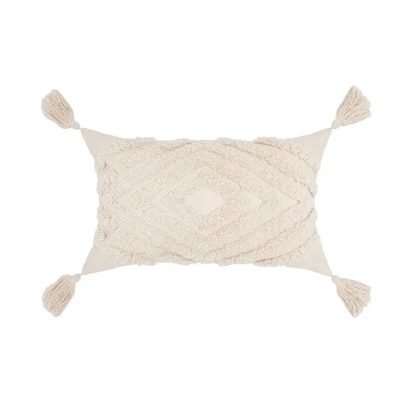Cream-colored boho tufted beige pillow cover with textured diamond pattern and tassel decor for living room use