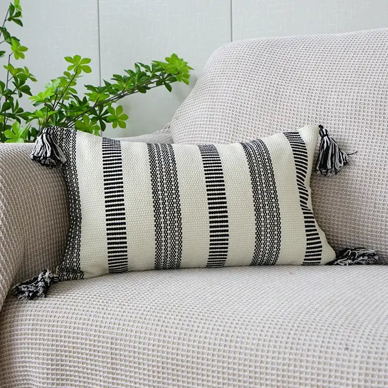 Boho tufted fringed black and white striped rectangular pillowcase with tassels for living room decor by decorbites