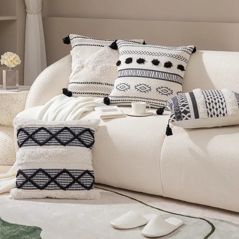 Bohob tufted fringed black and white geometric-patterned throw pillows with tassel accents for living room decorbites decor