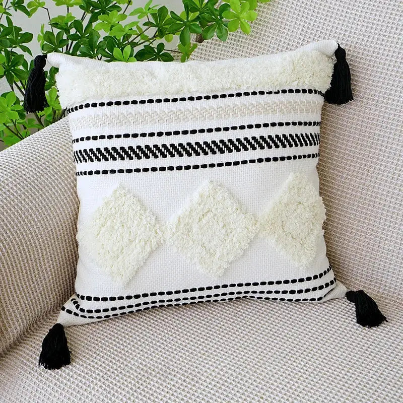 White woven boho tufted fringed pillowcase with black geometric patterns and tassels for living room decorbites decor
