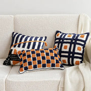 Three textured navy blue and burnt orange boho tufted pillow covers with geometric patterns for living room decorbites decor