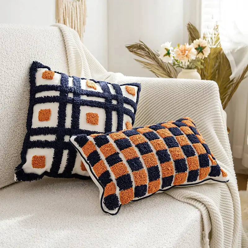 Two rectangular plush pillow covers with boho tufted navy and burnt orange checkered design for living room decorbites decor