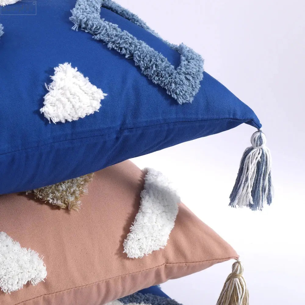 Blue cushion cover with fluffy white and light blue boho tufted tassel decorbites boho tufted tassel design