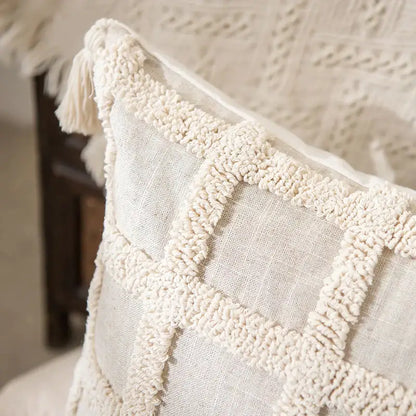 Cream-colored boho tufted tassel cushion cover with textured woven grid pattern for living room decor