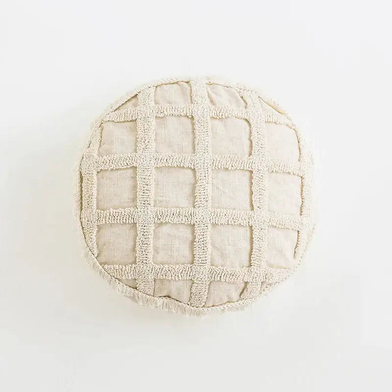 Beige round pouf with textured grid pattern made of soft frayed fabric decorbites boho tufted tassel cushion cover