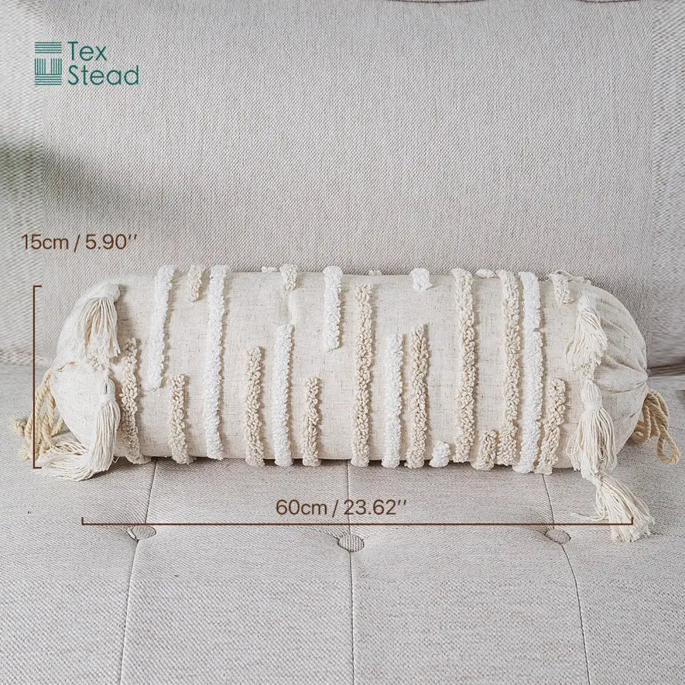 Cream-colored boho tufted tassel lumbar pillow with textured cylindrical shape and woven tassels for decorbites boho tufted style