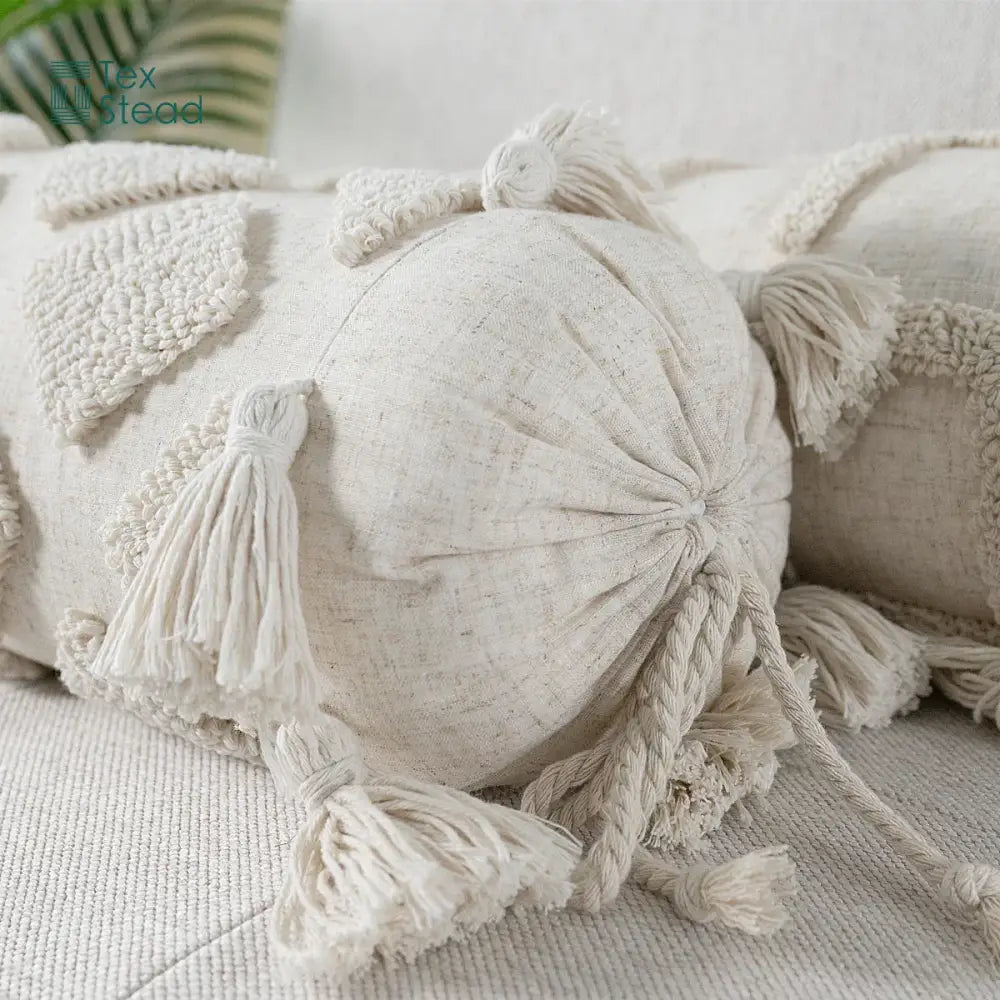 Cream-colored boho tufted tassel lumbar pillow with textured linen fabric decorative woven patches for bedroom decor
