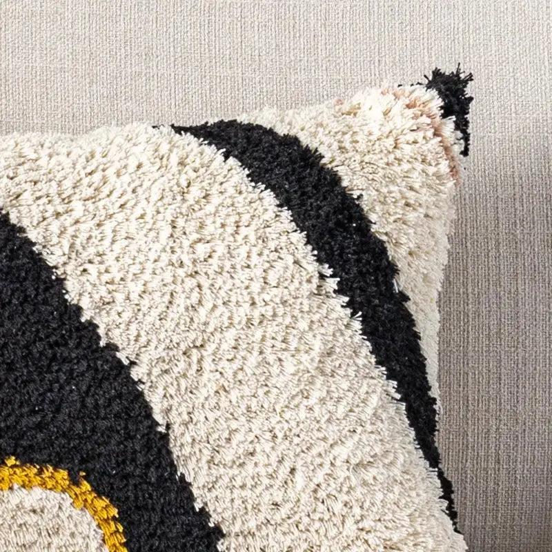 Cream and black textured pillow cover with fuzzy tufted design and bold geometric stripes for decorbites black abstract eye decor