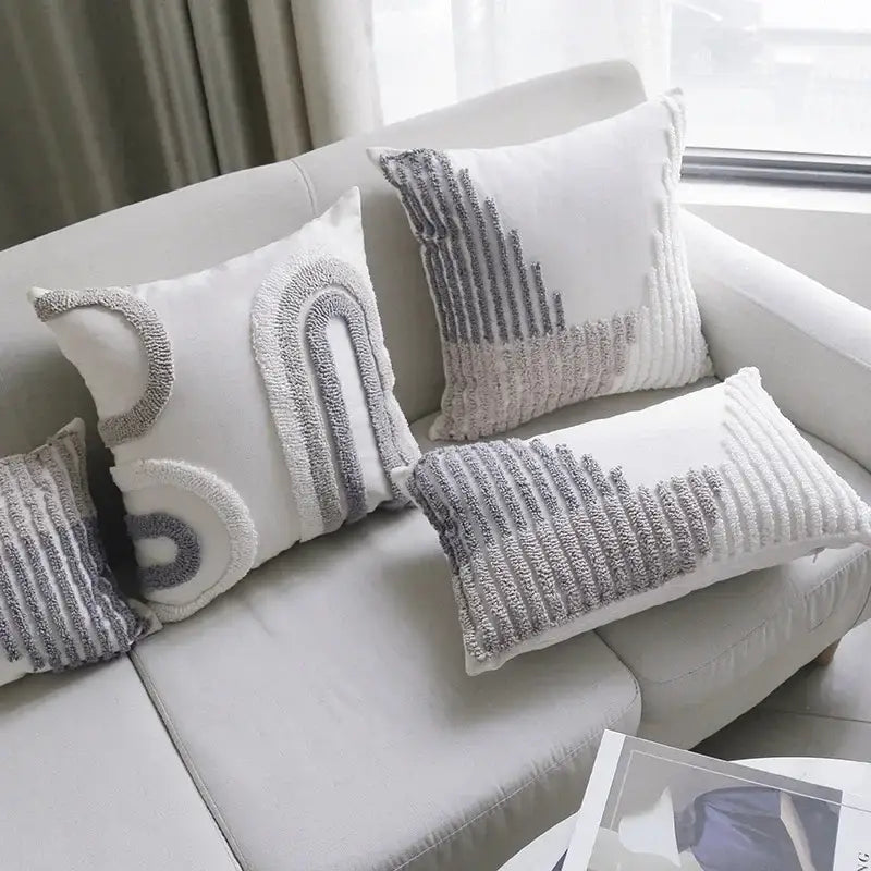 Boho white and gray tufted cushion cover with textured embroidered patterns in abstract geometric design by decorbites boho loop