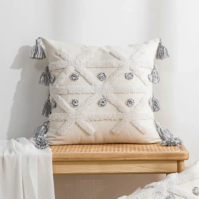 Cream-colored boho loop pillowcase with textured white embroidery silver buttons and gray tassels cushion cover decorbites boho loop