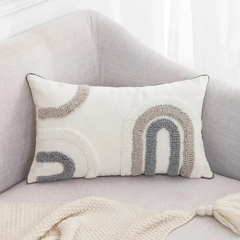 Cream-colored boho loop pillowcase with textured tufted rainbow design in gray and beige for cushion cover decorbites