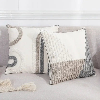 Two textured cream and gray boho loop pillowcase cushion covers with abstract geometric tufted designs for living room decorbites