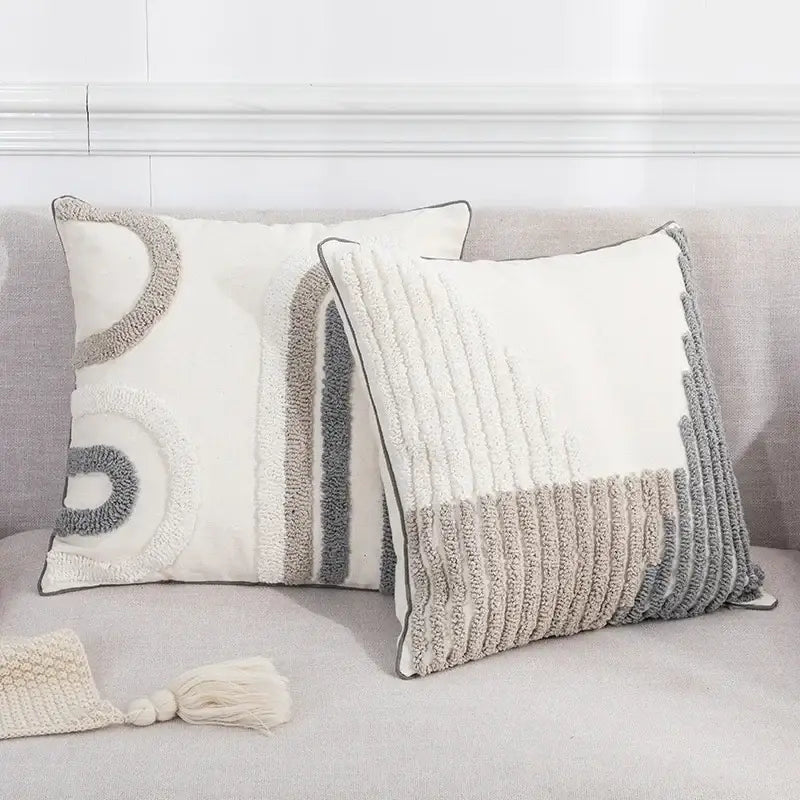 Two textured cream and gray boho loop pillowcase cushion covers with abstract geometric tufted designs for living room decorbites