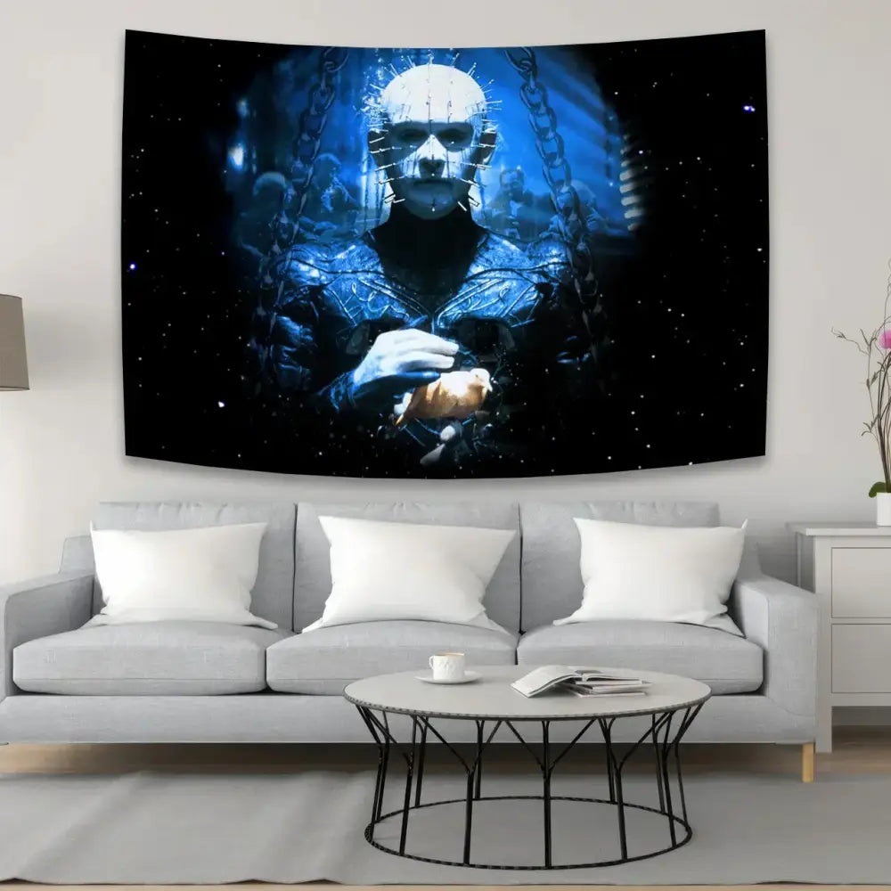 Blue and black horror movie wall tapestry featuring hellraisers pinhead above gray sofa for decorbites jack-o-lantern wall decor