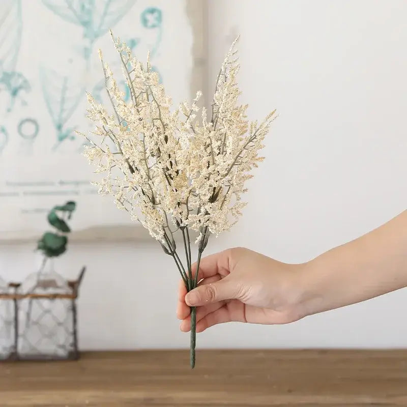 A boho wicker basket with pink and white decorbites forever dancing grass held with delicate dried dancing grass flowers