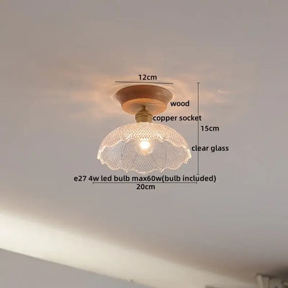 A clear glass lamp with fluted texture and wooden base complements decorbites copper wood led ceiling fixtures