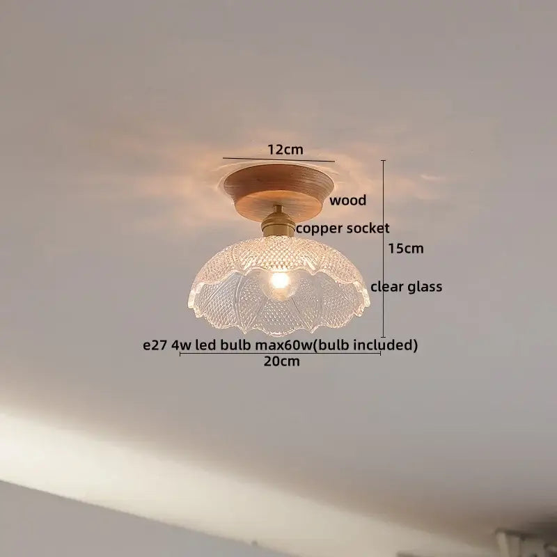 A clear glass lamp with fluted texture and wooden base complements decorbites copper wood led ceiling fixtures