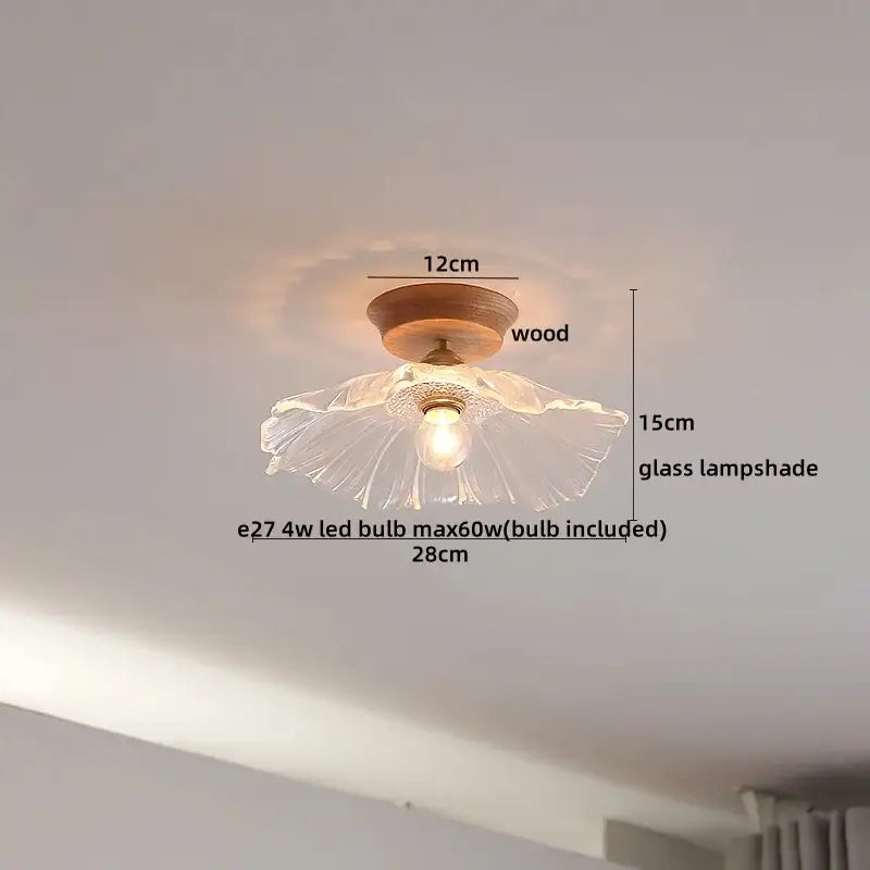 A boho woven rattan wood led ceiling light with a translucent fluted glass lampshade on a warm copper wood led base for bedroom decorbites decor