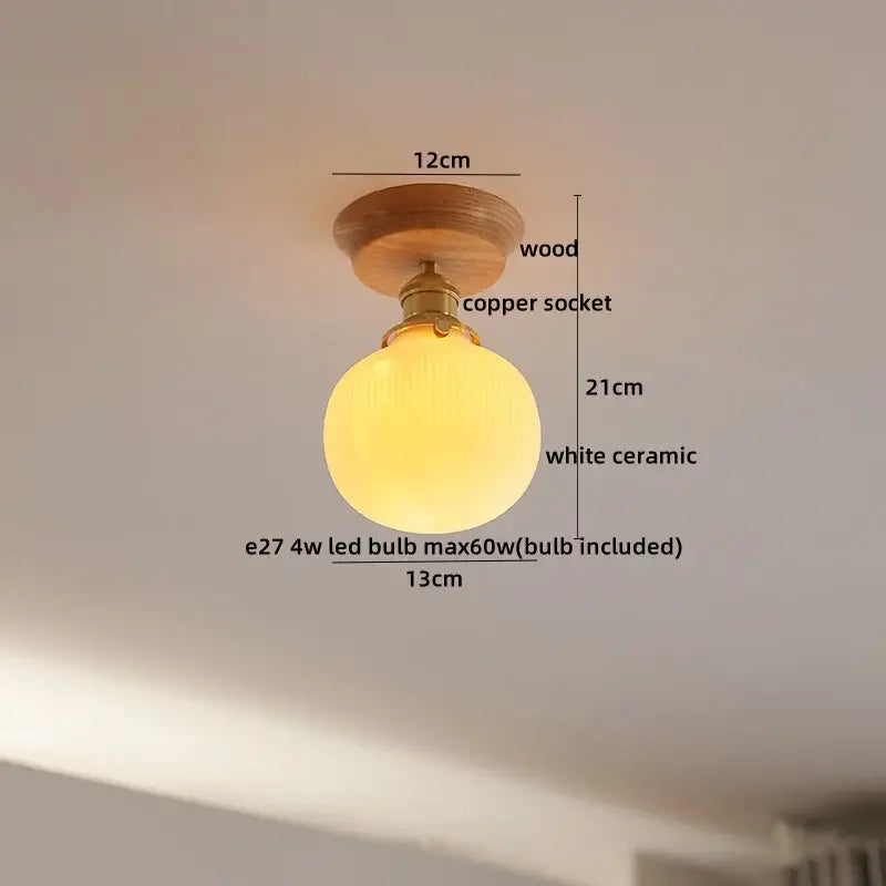 A warm white ceramic globe light with copper wood led socket and wooden base for boho wood led ceiling decorbites decor