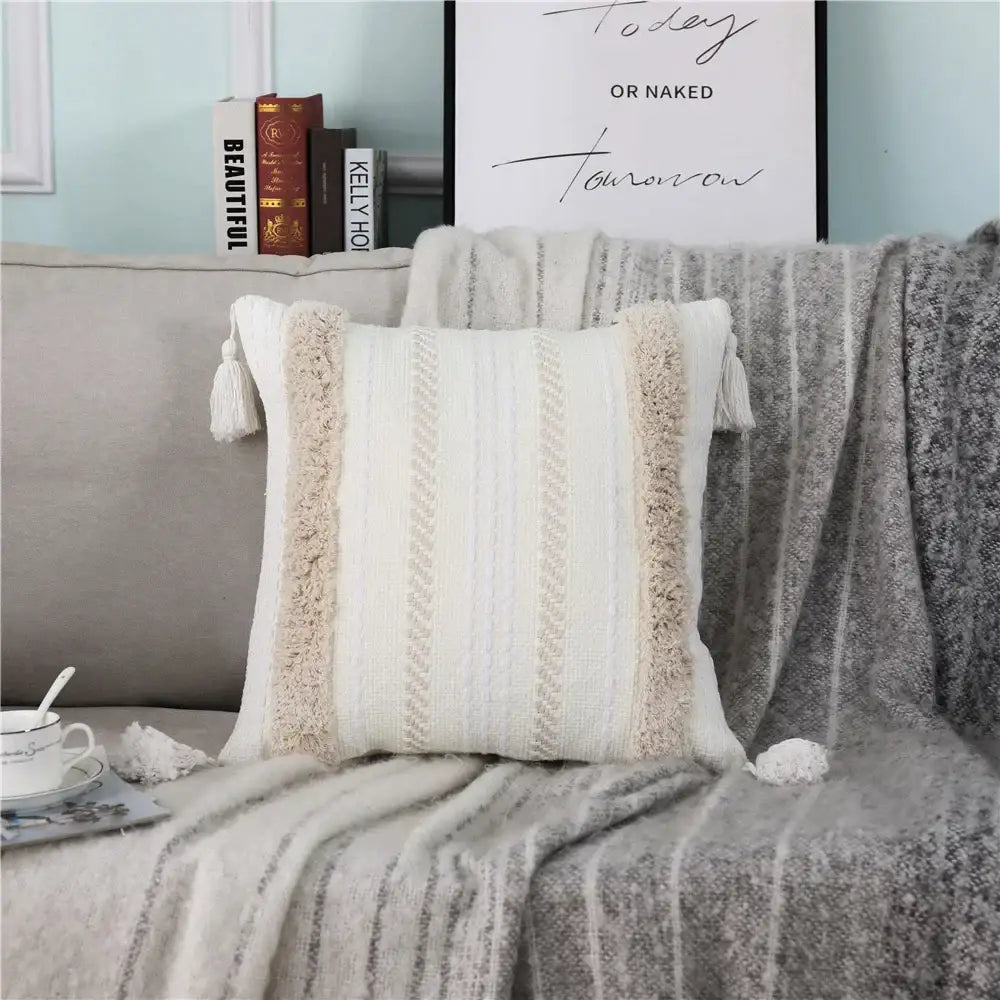 Cream-colored decorbites boho woven pillow case with textured vertical stripes and tassel trim for living room decorbites boho woven tassel pillow