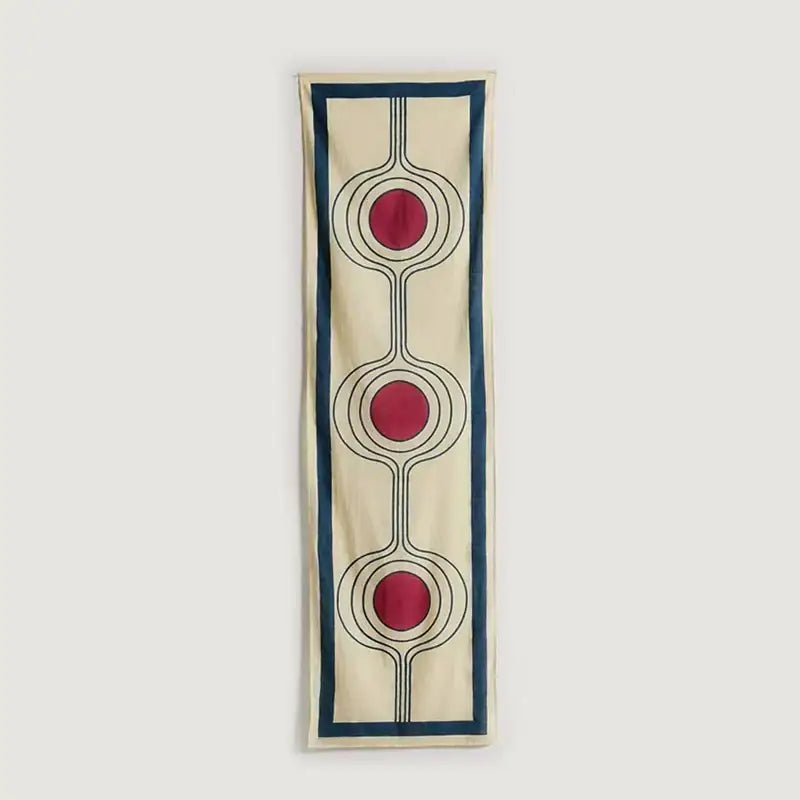 A cream textile celestial geometry tapestry with three bold red circles and navy blue border decorbites celestial geometry