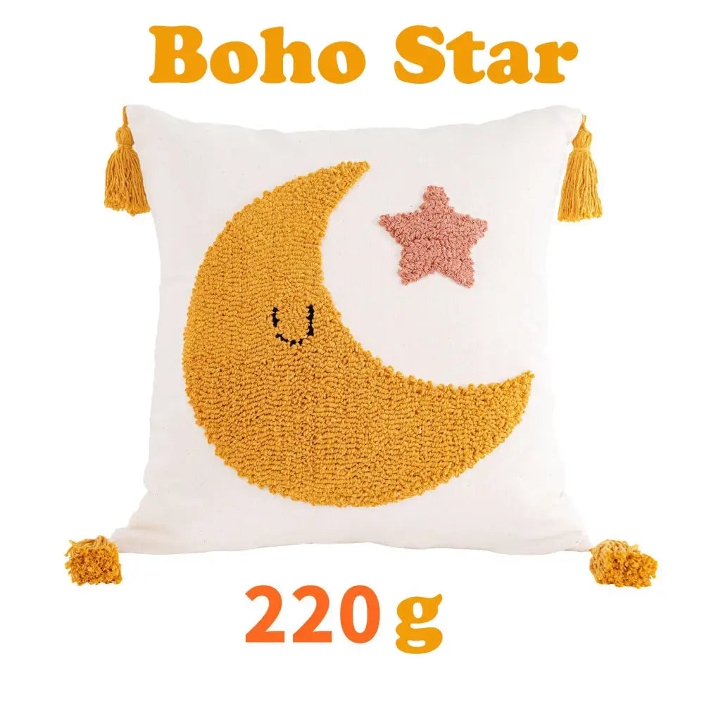 White cushion cover featuring textured mustard-yellow crescent moon and pink star with tassels from decorbites boho yellow collection