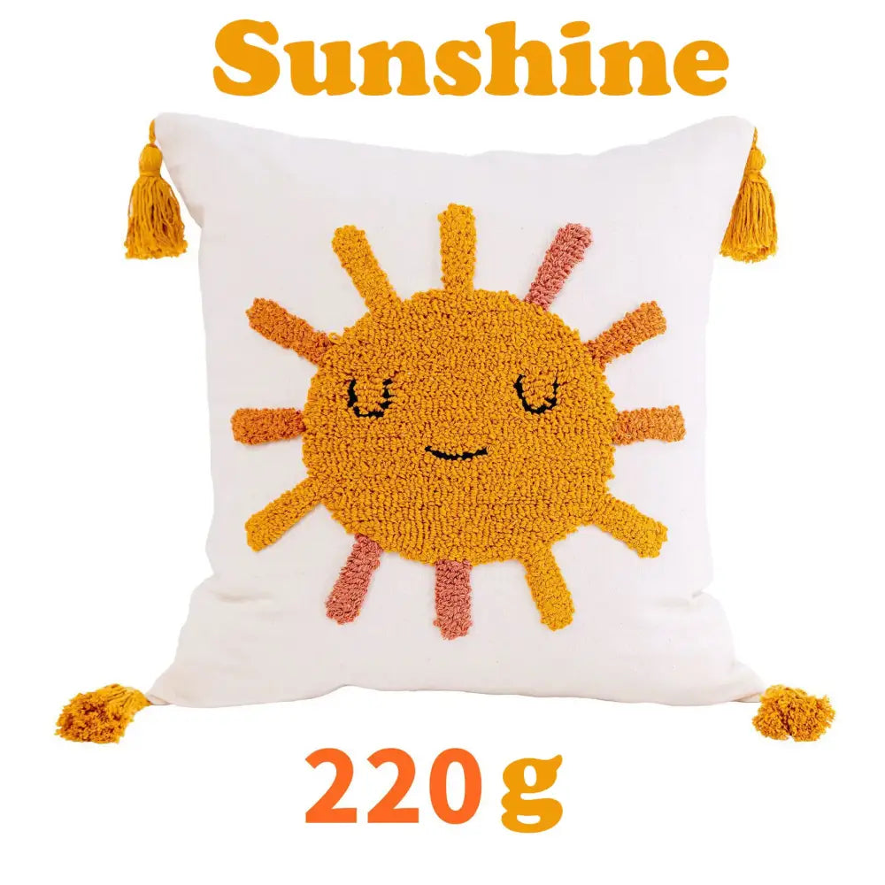 White cushion cover with cheerful textured orange and pink sun design mustard-yellow tassels decorbites boho yellow