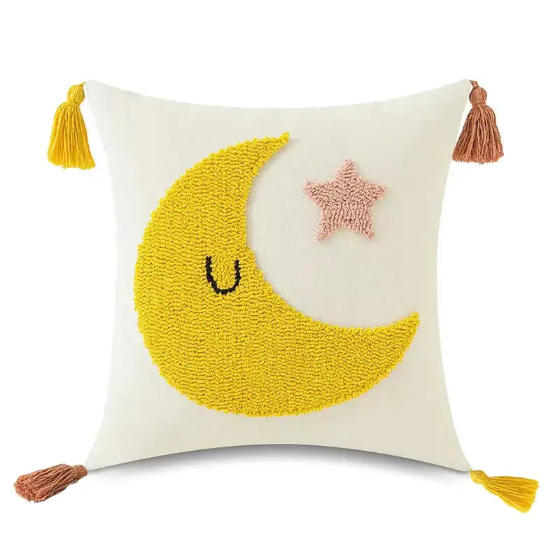 Cream-colored pillow cover with textured yellow crescent moon pink star and matching tassels decorbites boho yellow decor