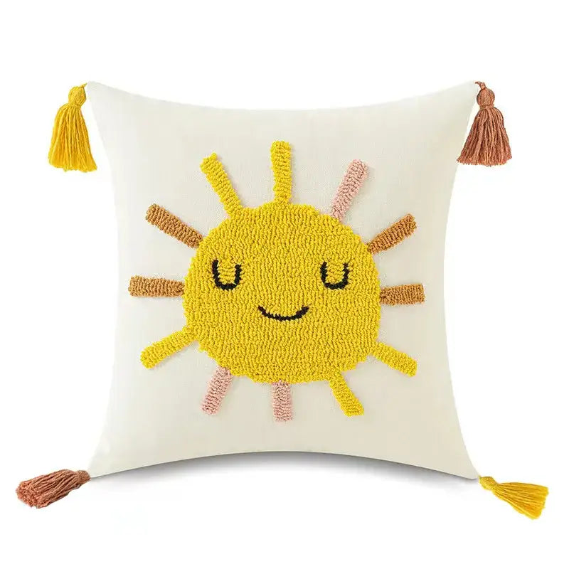 Cream-colored pillow cover with cheerful yellow sun in textured yarn and tassels for decorbites boho yellow rainbow style decor
