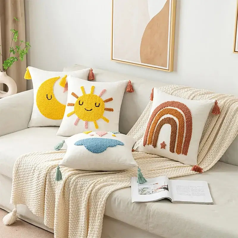 Set of four cream pillow covers with boho yellow rainbow sun moon cloud embroidery and tassels for decorbites boho yellow decor