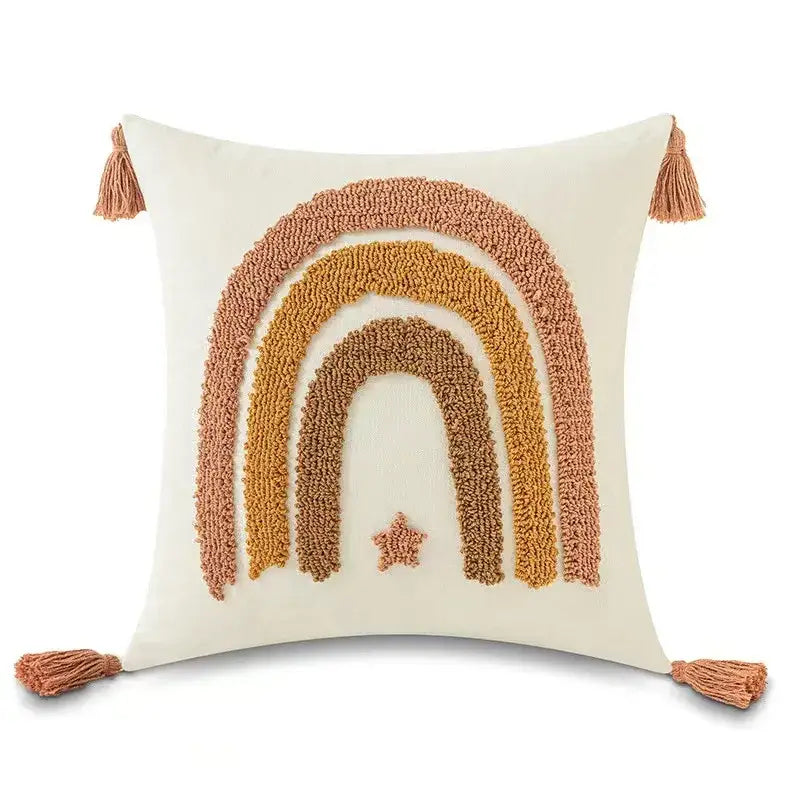 Cream-colored pillow cover with textured boho yellow rainbow design and tassels for decorbites boho yellow bedroom decor