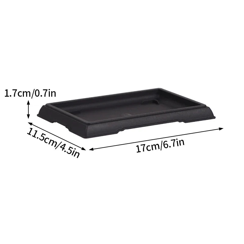 Black rectangular plastic plant pot tray with raised edges and shallow basin for bonsai or succulent plants para plantas