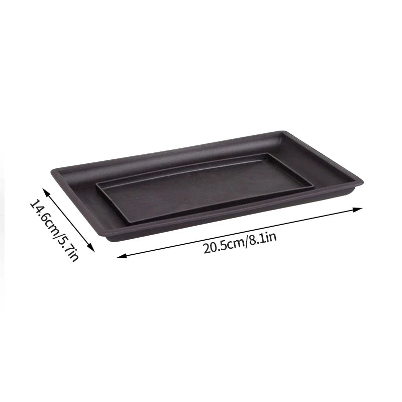 Black rectangular plant pot with nested compartment made of smooth matte plastic for outdoor garden use