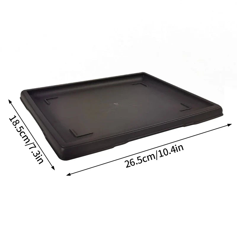 Black rectangular plastic plant pot tray with raised edges and molded corner reinforcements for para plantas use